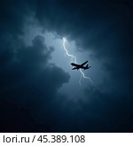 The aircraft encounters a severe thunderstorm, surrounded by dark clouds and illuminated by bright lightning strikes, highlighting the danger in the sky. Causes of air crashes. Generative AI. Стоковое AI-изображение, AI-художник Юлия Петровская / Фотобанк Лори