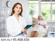 Young doctor with folder. Стоковое фото, фотограф Яков Филимонов / Фотобанк Лори