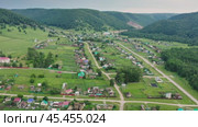 Южный Урал, Башкирия, село Ташла. Вид с воздуха. Southern Urals, Bashkiria, Tashla village. Aerial view. (2024 год). Стоковое видео, видеограф Евгений Романов / Фотобанк Лори