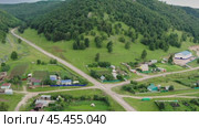 Южный Урал, Башкирия, село Ташла. Вид с воздуха. Southern Urals, Bashkiria, Tashla village. Aerial view. (2024 год). Стоковое видео, видеограф Евгений Романов / Фотобанк Лори