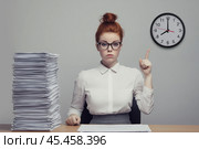 Girl sits at a desk in an office and points her finger at the time on the clock. Стоковое AI-изображение, AI-художник Дмитрий Киселёв / Фотобанк Лори