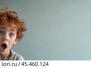 Surprised red-haired boy peers out from the edge of the frame. Стоковое AI-изображение, AI-художник Дмитрий Киселёв / Фотобанк Лори