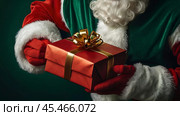 Hands of Santa Claus in close-up with a gift box in his hands on a green background. Gifts from Santa Claus. Стоковое AI-изображение, AI-художник Photojuli / Фотобанк Лори