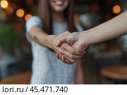 Crop close up of young Caucasian woman stretch hand get acquainted greeting with client or customer at meeting. Female employee handshake welcoming newcomer newbie. Acquaintance concept. Стоковое AI-изображение, AI-художник Sergey Grishin / Фотобанк Лори
