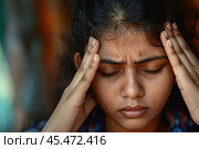 Closeup view frown face of indian woman feeling strong headache touch temple to reduce severe pain, suffering from panic attack in office, migraine overworked person or hangover alcohol abuse concept. Стоковое AI-изображение, AI-художник Sergey Grishin / Фотобанк Лори