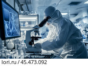 Two Scientists In Sterile Suites At Research Factory: Engineer Using Microscope And Desktop Computer To Inspect Microchip. Стоковое AI-изображение, AI-художник Sergey Grishin / Фотобанк Лори