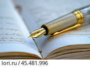 Elegant fountain pen lying on an open notebook, writing instrument for journaling and creative expression. Стоковое AI-изображение, AI-художник Иван Рябоконь / Фотобанк Лори