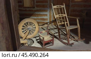 Old vintage things, rocking chair, buckle. Installation, old farm, museum. Wooden house, dull color, best museums of the world. Редакционное видео, видеограф Vladislav Baranov / Фотобанк Лори