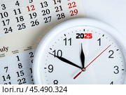 sheet of a calendar with clockface. Стоковое фото, фотограф Александр Калугин / Фотобанк Лори