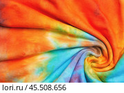 Abstract tie dye multicolor fabric cloth Boho pattern texture. Стоковое фото, фотограф Александра Конопля / Фотобанк Лори
