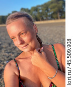 Woman in a swimsuit on the background of a pebble beach in Kobuleti, Georgia. Стоковое фото, фотограф IRYNA ZAKHARANKA / Фотобанк Лори
