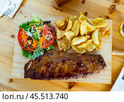 Delicious barbecue ribs with spicy salsa sauce. Стоковое фото, фотограф Яков Филимонов / Фотобанк Лори