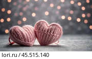 The banner. Background for Valentine's Day. Knitted hearts with festive lights in the form of a side in the background. a mock-up of an invitation card for a Valentine's Day party, a place to copy. Стоковое AI-изображение, AI-художник Photojuli / Фотобанк Лори