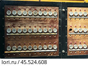 Panel with numbers and bulbs marked with numbers for manual switching of the telephone line. Old telephone exchange. Стоковое фото, фотограф Татьяна Степанищева / Фотобанк Лори