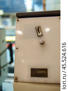 Coin acceptor at the old turnstile in the subway. Стоковое фото, фотограф Татьяна Степанищева / Фотобанк Лори