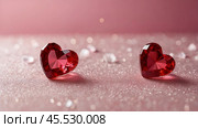A banner for Valentine's Day. Crystal red hearts with festive lights in the form of a side in the background. A mock-up of an invitation card for a Valentine's Day party, a place to copy. Стоковое AI-изображение, AI-художник Photojuli / Фотобанк Лори