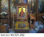 Varna, Bulgaria. August 15, 2024. City center. The Church of St. Nicholas the Wonderworker. An icon depicting the Russian admiral, commander of the Black Sea Fleet Ushakov, canonized. Редакционное фото, фотограф Мария Фетисова / Фотобанк Лори