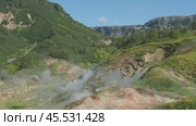 Hot springs and fumaroles in Valley of Geysers. Стоковое видео, видеограф Михаил Коханчиков / Фотобанк Лори