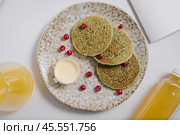 pancakes with berries and cream on a plate top view. Стоковое фото, фотограф Abakumova Ekaterina / Фотобанк Лори