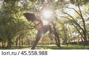 Girl Performing Tricks on Aerial Hoop Outdoors. Стоковое видео, видеограф Илья Шаматура / Фотобанк Лори
