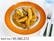 Piquant chicken with cava, cinnamon and pear sauce at plate. Стоковое фото, фотограф Яков Филимонов / Фотобанк Лори