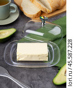 Dish with block of tasty butter. Стоковое фото, фотограф Евгения Трушкова / Фотобанк Лори