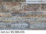 Old wall lined with decorative stone. Weathered rough surface of stones. Beautiful masonry in a classic style. Vintage texture great for background and design. Стоковое фото, фотограф Андрей Степанов / Фотобанк Лори