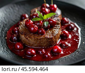 Veal in cherry sauce. Enjoy your meal! Стоковое AI-изображение, AI-художник Сергей Елизарьев / Фотобанк Лори