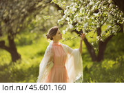 Happy woman near the blossoming apple tree. Стоковое фото, фотограф Дмитрий Киселёв / Фотобанк Лори