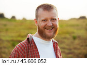 Cheerful, bearded man in a red shirt. Стоковое фото, фотограф Дмитрий Киселёв / Фотобанк Лори
