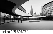 Modern architecture and urban landscape converge in city plaza with striking skyscrapers and inviting spaces. Стоковое AI-изображение, AI-художник Сергей Толмачёв / Фотобанк Лори