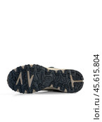KRASNOYARSK, RUSSIA - December 1, 2024: Beige Merrell sneakers on a white background. Редакционное фото, фотограф Плотников Дмитрий / Фотобанк Лори