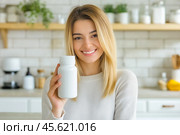 The girl advertises Biologically active additives, medicines. A white jar is in the young woman's hand. Стоковое AI-изображение, AI-художник Ирина Ручушкина / Фотобанк Лори