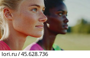 Determined athletes prepare confidently for competitive sports event. Стоковое AI-видео, аниматор Sabyna75 / Фотобанк Лори