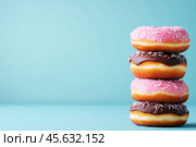 Фон с пончиками. Стоковое AI-изображение, AI-художник Александр Жуков / Фотобанк Лори