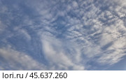 Floating fluffy clouds. Beautiful sunny blue sky with wispy smoky white cumulus and cirrus on different layers. Timelapse. Стоковое видео, видеограф Наталия Попова / Фотобанк Лори