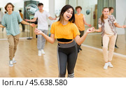 Youth boys and girls dancing modern dance in ballroom. Стоковое фото, фотограф Яков Филимонов / Фотобанк Лори