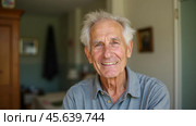Portrait of joyful elderly man with wide smile and happy expression. Wrinkles and gray hair signify aging, while his content and bright look. positivity, and satisfaction in senior life. Стоковое AI-изображение, AI-художник Павел Муравьев / Фотобанк Лори