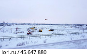 Снегоидущий ландшафт с нефтяными установками. Стоковое фото, фотограф Рустам Солтукием / Фотобанк Лори