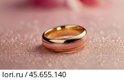 Gold wedding rings on a pink background with a side. Wedding rings. The wedding day. The newlyweds. Стоковое AI-изображение, AI-художник Photojuli / Фотобанк Лори