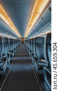 Empty seats forming aisle inside airplane. Стоковое AI-видео, аниматор Юрий Поздников / Фотобанк Лори