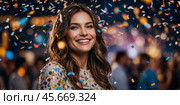 Smiling Woman Showered With Confetti in the party for celebration, event, welcome new year eve. Стоковое фото, фотограф Александр Поташев / Фотобанк Лори