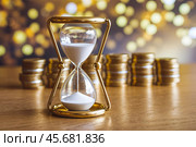 Песочные часы и столбики монет как афоризм Время это деньги. Стоковое AI-изображение, AI-художник Сергей Комаров / Фотобанк Лори