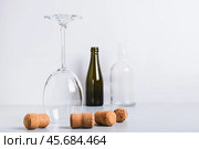 Alcohol abstinence, upside down wine glass among corks on table. Стоковое фото, фотограф Елена Руй / Фотобанк Лори