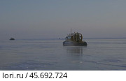 Hovercraft on frozen ice surface of Baikal lake. Стоковое видео, видеограф Михаил Коханчиков / Фотобанк Лори