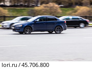 Very fast driving blue Mitsubishi Lancer sedan Seventh generation on the street (2021 год). Редакционное фото, фотограф Константин Григорьев / Фотобанк Лори