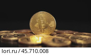 Gold Bit Coin BTC Cryptocurrency Coins on a black background. Bitcoin is a worldwide cryptocurrency and digital payment system called the first decentralized digital currency. Стоковое видео, видеограф Андрей Армягов / Фотобанк Лори