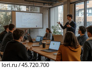 Современный офис, эффективная команда. На фотографии изображена команда, работающая над общим проектом. На большом экране с графиками отображаются их достижения и перспективы на будущее. Стоковое AI-изображение, AI-художник Ярославский Максим / Фотобанк Лори