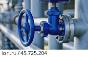 Water pipes and pressure control industrial system. Blue closing valve on water pump station. Gray Pipeline with tanks for supply of high-pressure aqua. Big Valve in a steam heating system. Plumbing. Стоковое AI-видео, аниматор Марина Демидюк / Фотобанк Лори