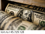 Close up of benjamin franklin staring from one hundred dollar bills. Стоковое AI-изображение, AI-художник Иван Рябоконь / Фотобанк Лори
